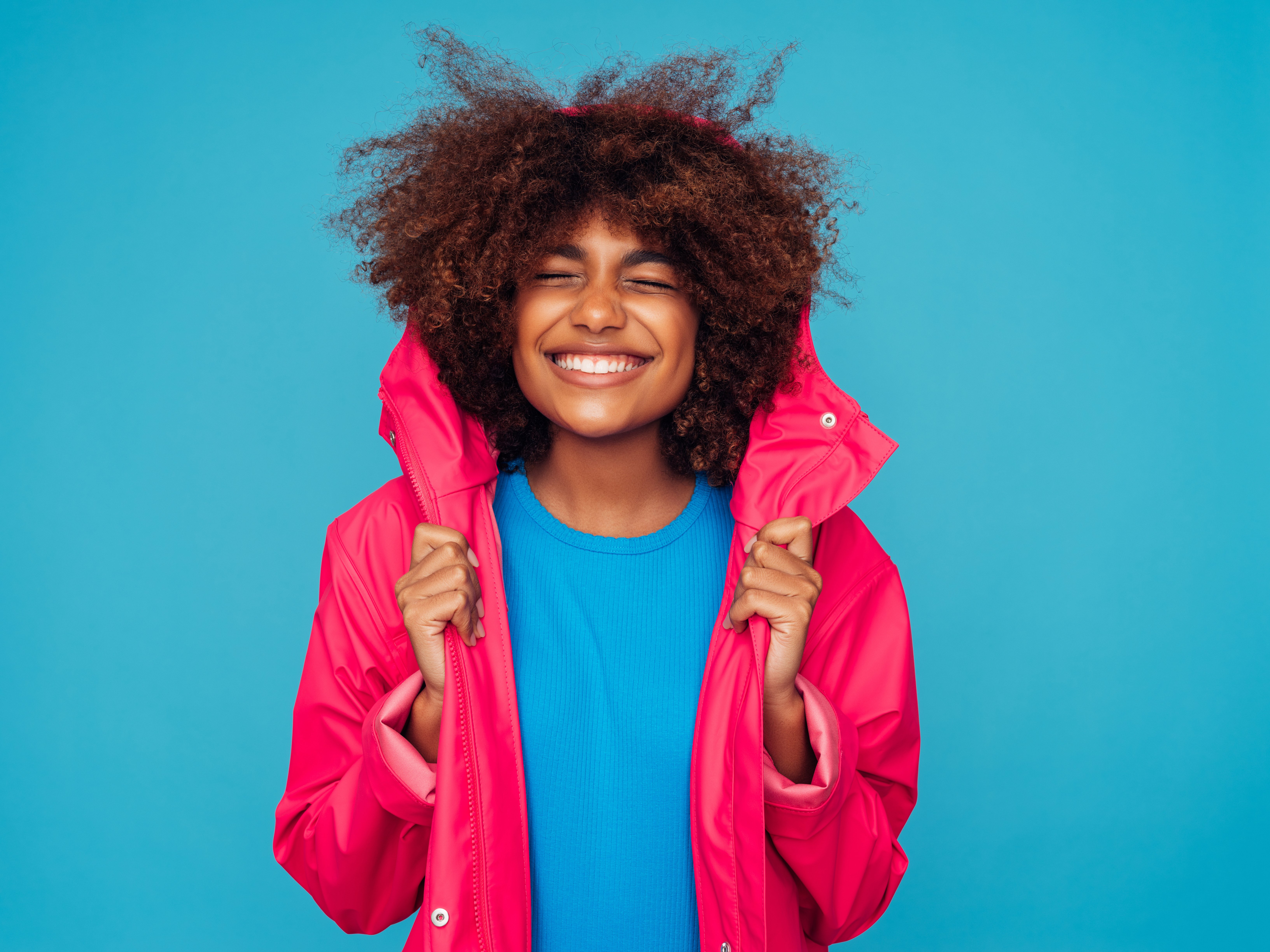 Young woman wearing raincoat